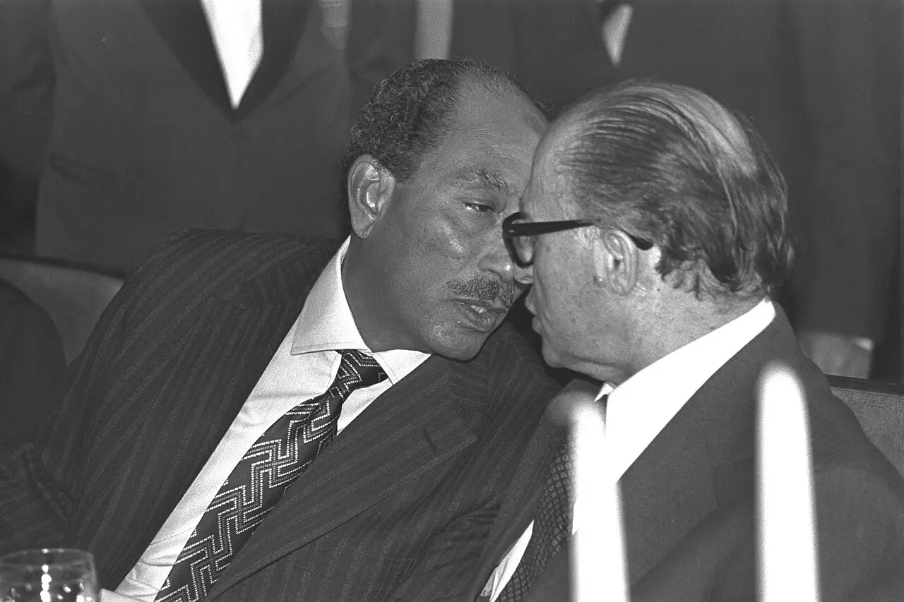 Egyptian President Anwar Sadat talks with Israeli Prime Minister Menachem Begin at a dinner in Jerusalem's King David Hotel during Sadat's November 1977 visit to Israel.