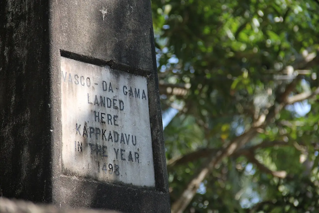 A stone memorial plaque at Kappad beach, Kerala, India, reading 'Vasco-da-Gama landed here Kappkadavu in the year 1498.'