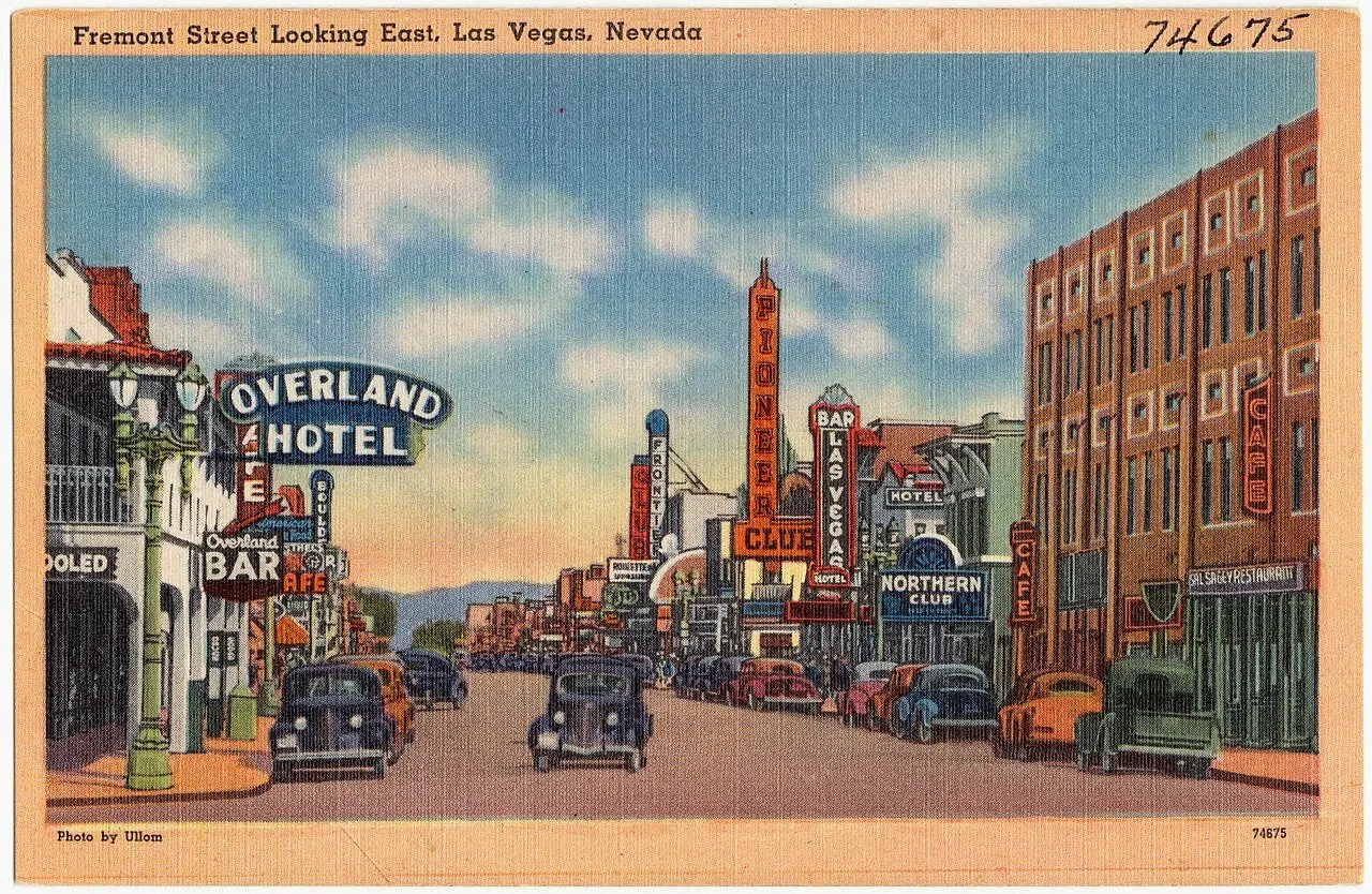 Vintage Tichnor Bros. linen postcard of Fremont Street looking east in Las Vegas, Nevada, circa 1930–1945, with early hotel and casino signs including the Pioneer Club and Northern Club.