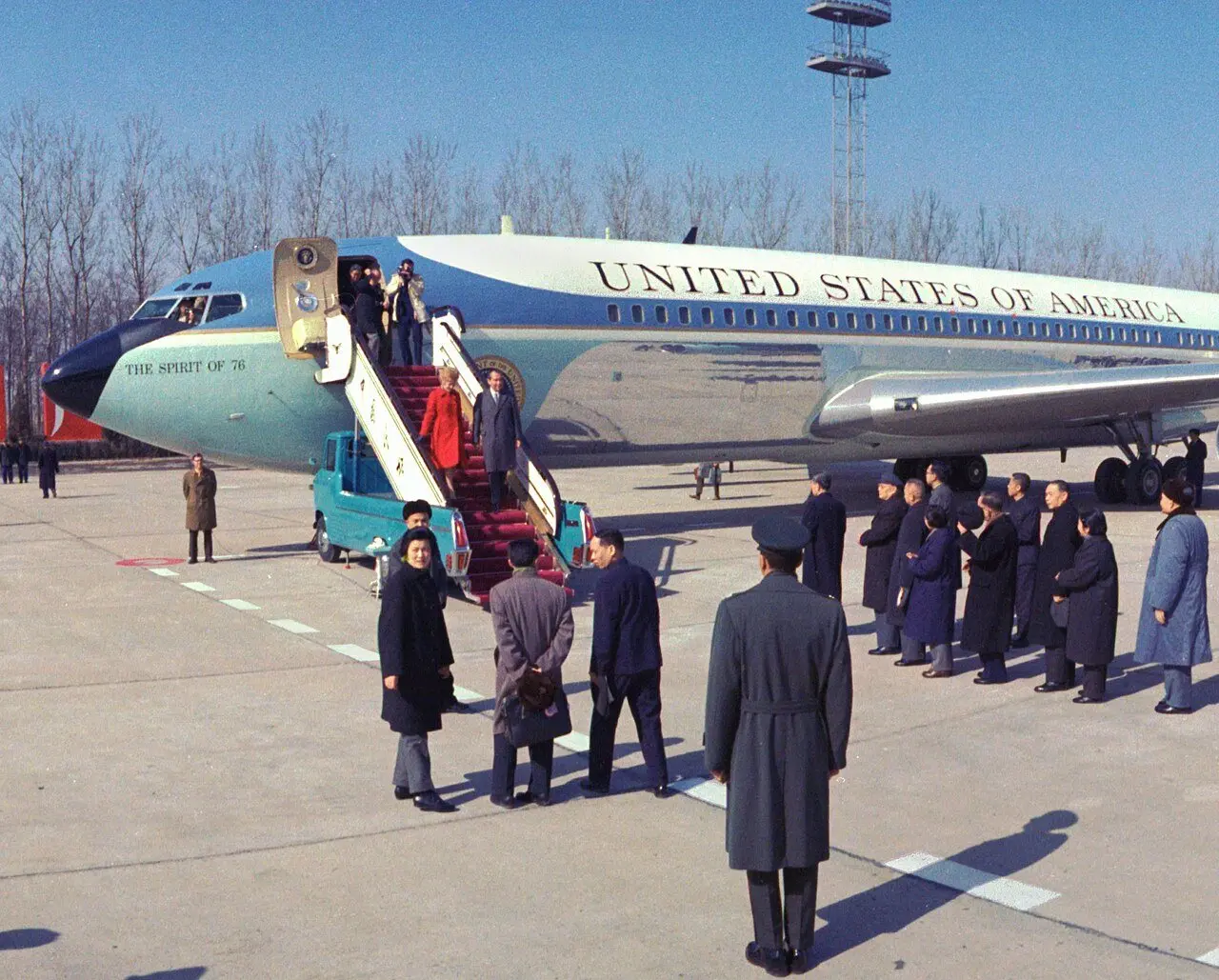 Richard and Pat Nixon disembarking from Air Force One upon arrival in China, February 1972, as Chinese officials wait on the tarmac