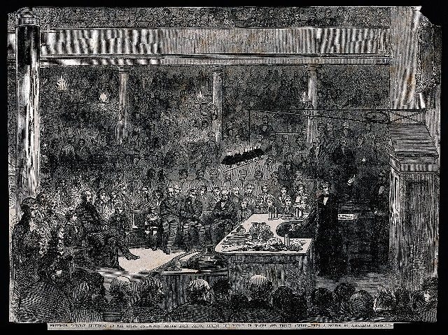An 1856 engraving of Michael Faraday lecturing at the Royal Institution in London, with Prince Albert, the Prince of Wales, and Prince Alfred in the audience.