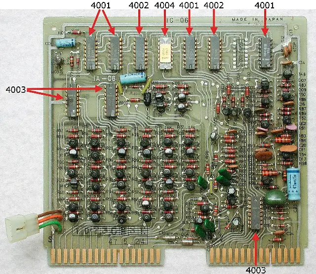 An Intel 4004 microprocessor mounted on a Busicom calculator circuit board, with the 4004 chip labeled among the board's components