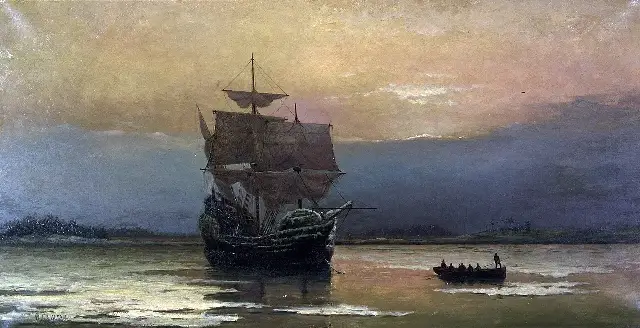 William Halsall's 1882 oil painting of the Mayflower at anchor in Plymouth Harbor, with passengers rowing toward shore in a small boat