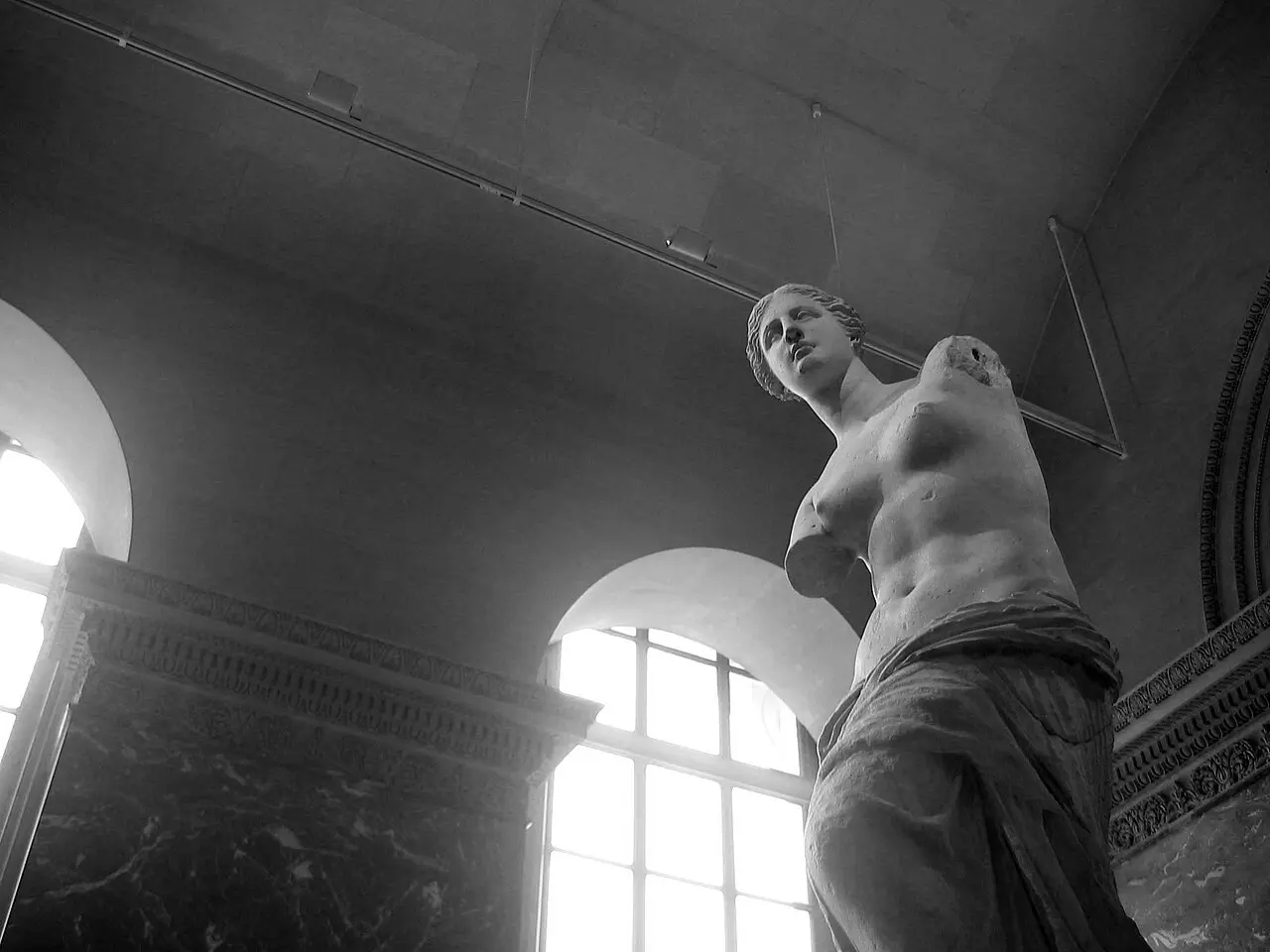 The Venus de Milo photographed from below in its gallery at the Louvre Museum in Paris.