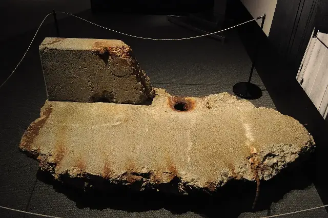 A fragment of the original Tacoma Narrows Bridge's concrete deck, recovered from Puget Sound after the collapse and now on display; the bridge tore itself apart on November 7, 1940.