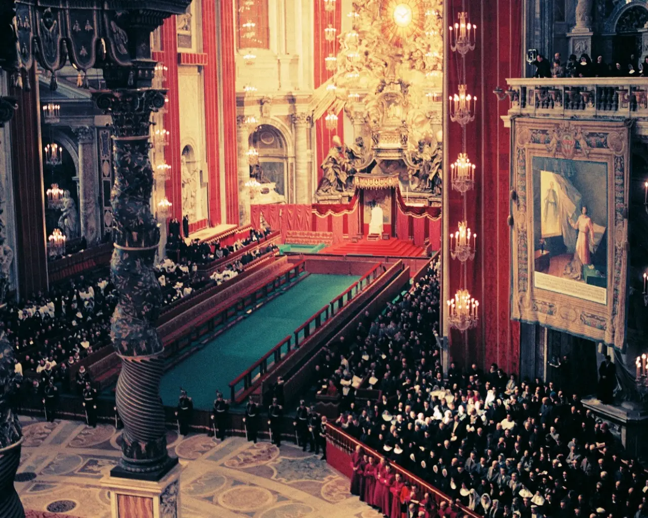 Photograph by Lothar Wolleh of the Second Vatican Council in session inside St. Peter's Basilica, with thousands of bishops in white vestments seated in long rows beneath the great dome.
