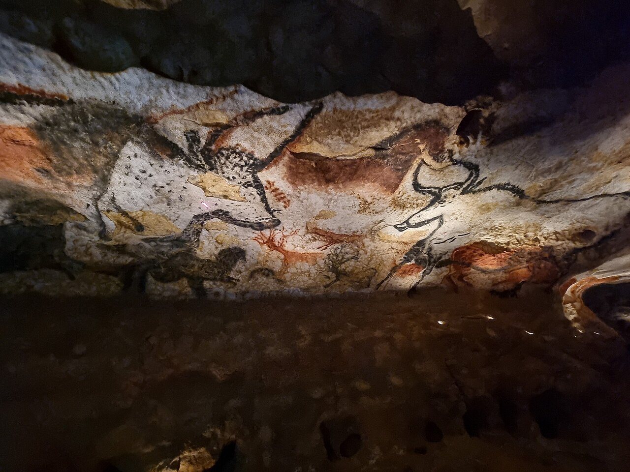 Prehistoric paintings of horses and other animals on the rock wall of the Lascaux cave in France