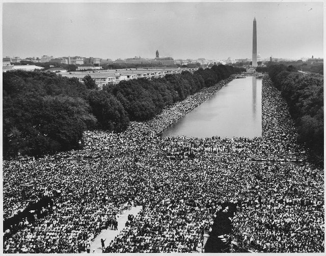 Wide-angle view of the enormous crowd at the March on Washington for Jobs and Freedom on August 28, 1963, stretching along the Reflecting Pool toward the Washington Monument.