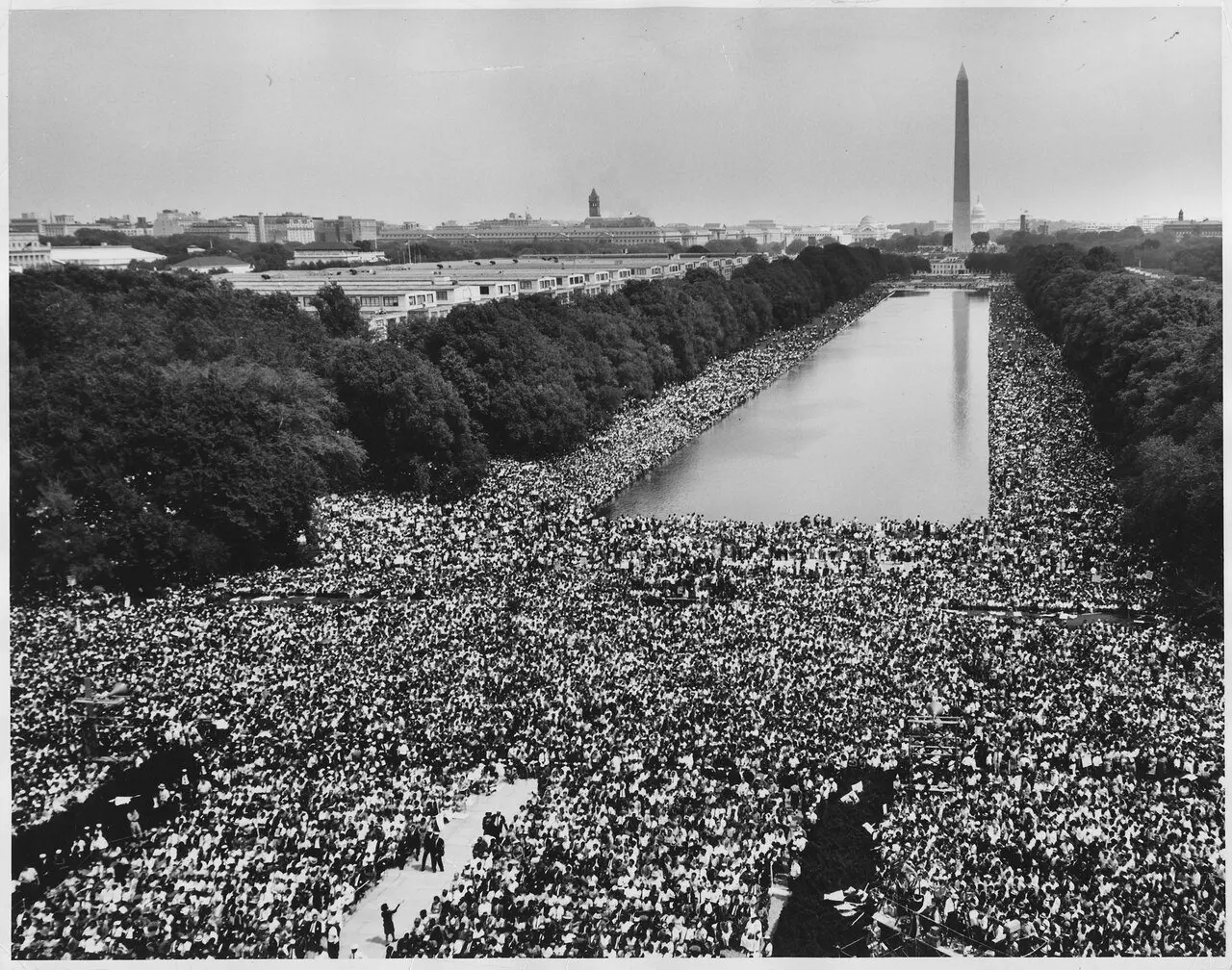 Wide-angle view of the enormous crowd at the March on Washington for Jobs and Freedom on August 28, 1963, stretching along the Reflecting Pool toward the Washington Monument.