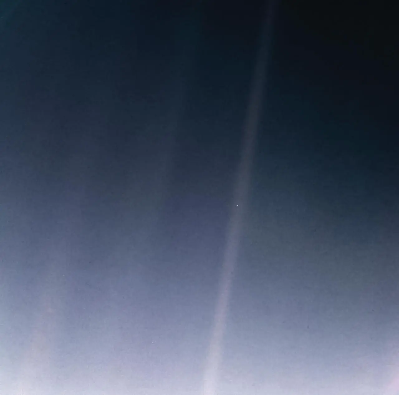 The 2020 reprocessed view of the Pale Blue Dot: Earth as a tiny speck in a sunbeam, photographed by Voyager 1 on February 14, 1990