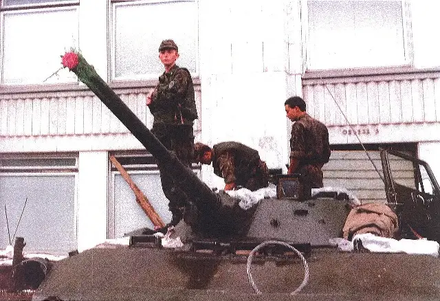 Young soldiers with flowers placed on their armored vehicle during the August 1991 coup in Moscow.