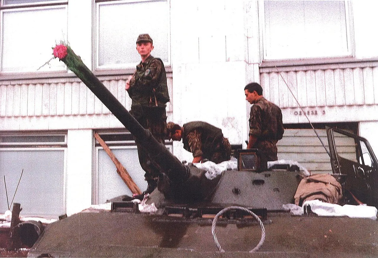 Young soldiers with flowers placed on their armored vehicle during the August 1991 coup in Moscow.