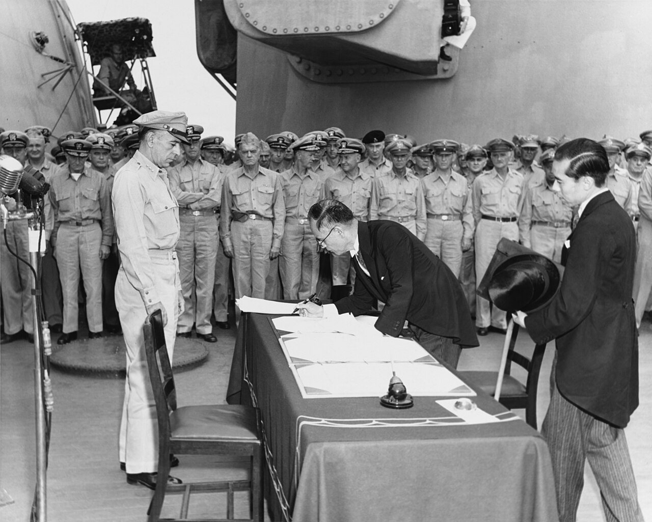 Japanese Foreign Minister Mamoru Shigemitsu signs the Instrument of Surrender aboard the USS Missouri in Tokyo Bay on September 2, 1945.