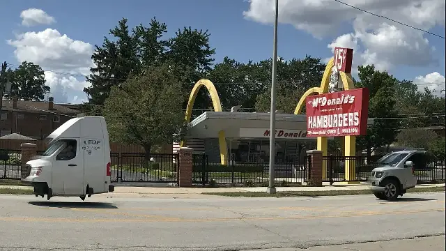The McDonald's #1 Store Museum replica in Des Plaines, Illinois, with golden arches and a red sign reading 'McDonald's Hamburgers' and 'Over 1 Million,' photographed in 2017