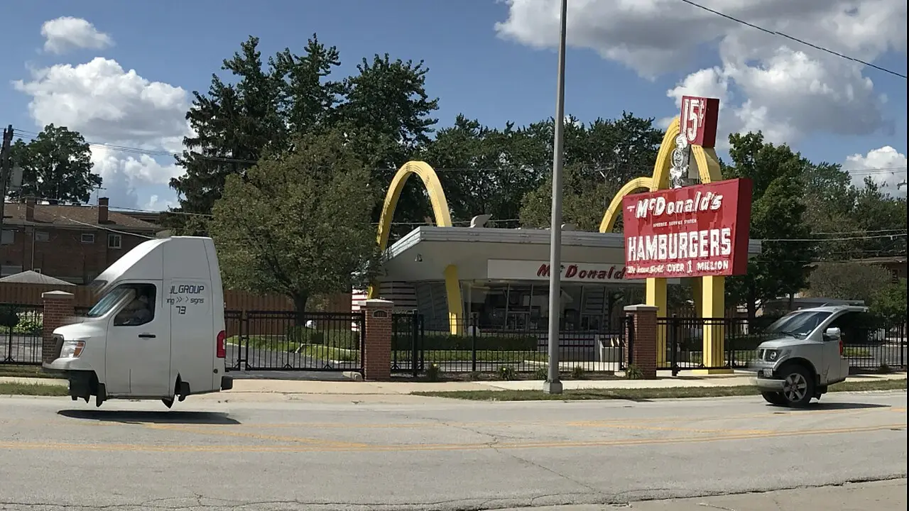 The McDonald's #1 Store Museum replica in Des Plaines, Illinois, with golden arches and a red sign reading 'McDonald's Hamburgers' and 'Over 1 Million,' photographed in 2017