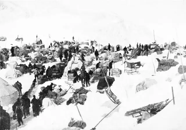 Prospectors with supply sleds climbing the snowy Chilkoot Pass in 1898, the route to the Klondike gold fields.