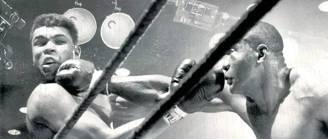 Sonny Liston landing a punch on Cassius Clay during their February 25, 1964 heavyweight title fight in Miami Beach