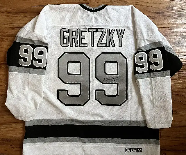 A signed early-1990s Los Angeles Kings #99 Wayne Gretzky jersey — the number he wore in Los Angeles after the 1988 trade.