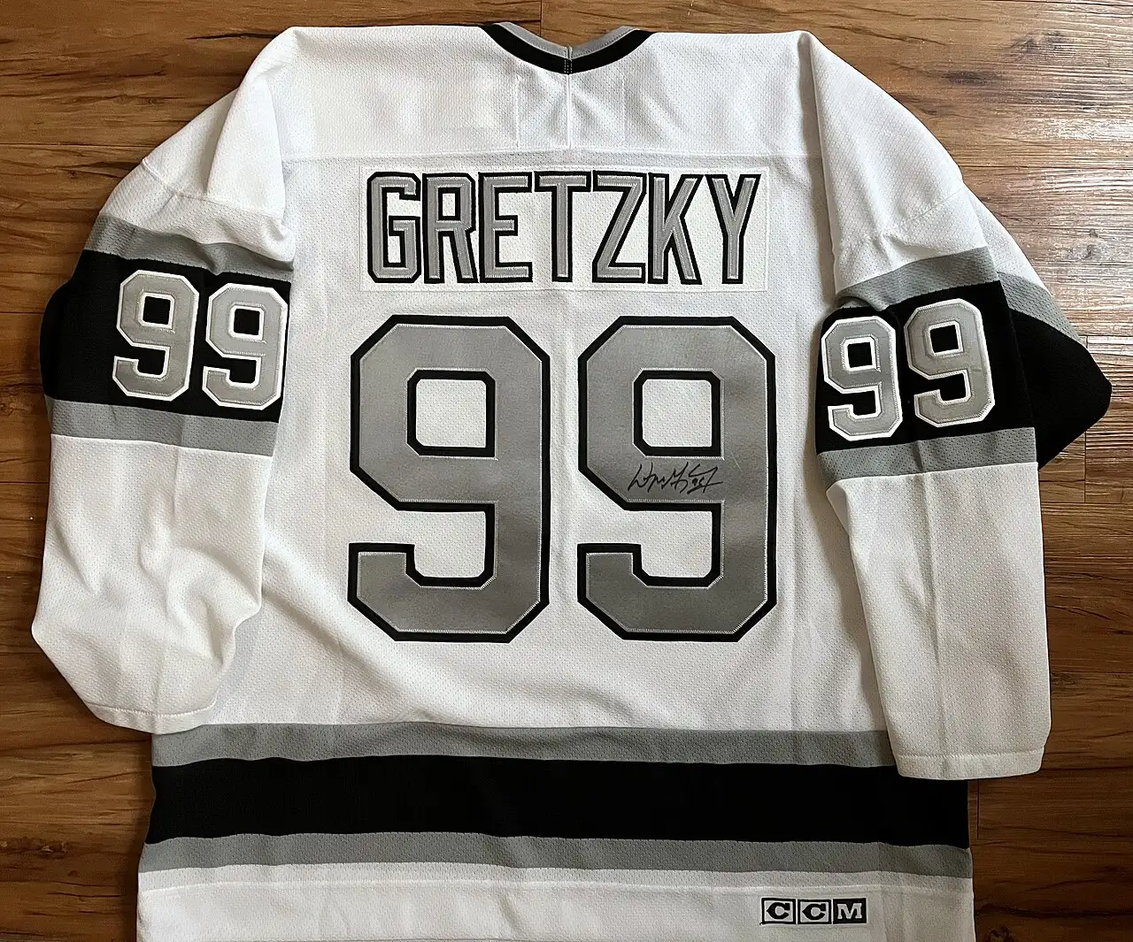 A signed early-1990s Los Angeles Kings #99 Wayne Gretzky jersey — the number he wore in Los Angeles after the 1988 trade.