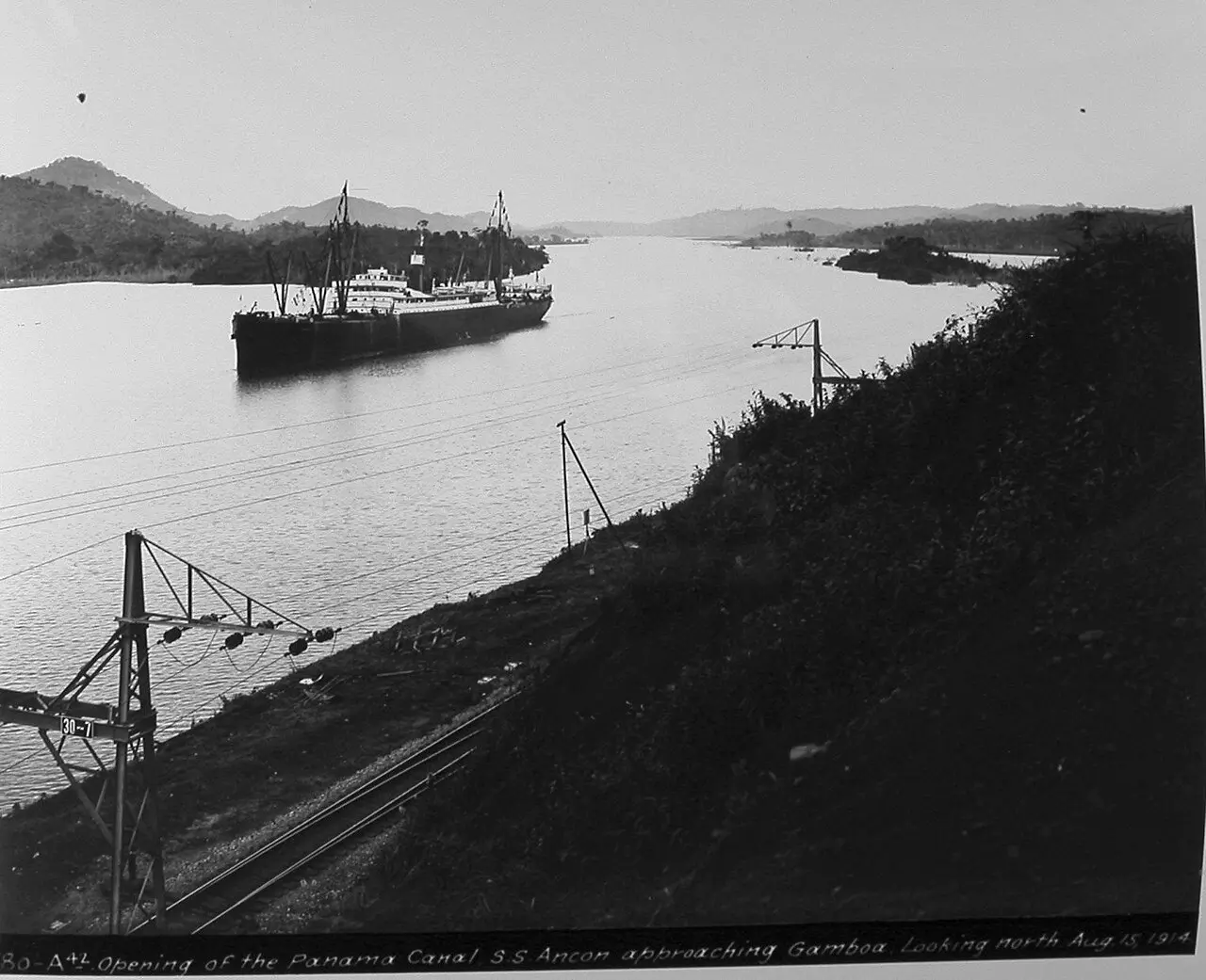 The SS Ancon approaching Gamboa on August 15, 1914, during the first official transit of the Panama Canal.