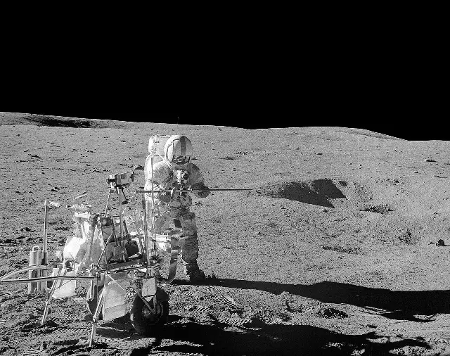 Apollo 14 astronaut Alan Shepard on the lunar surface holding his makeshift golf club.