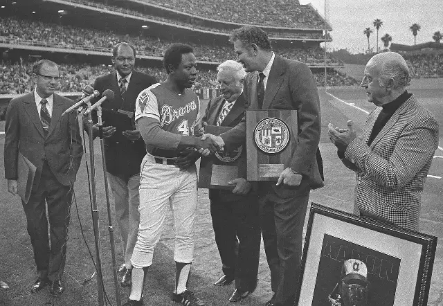 Hank Aaron in his Braves uniform being honored by Los Angeles officials at Dodger Stadium in May 1974, weeks after his record 715th home run.