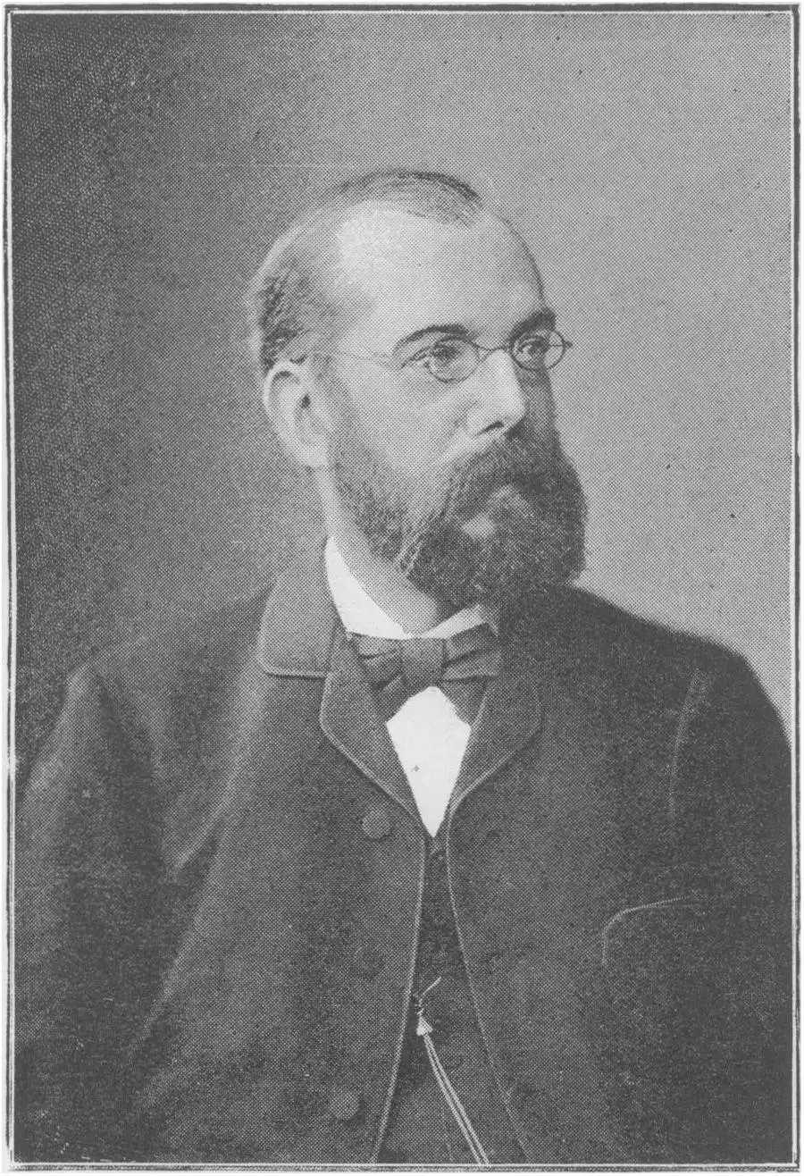 Portrait photograph of Robert Koch, bearded and wearing round glasses.