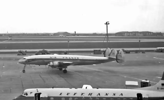 An Air France Lockheed Constellation and a Lufthansa Vickers Viscount on the tarmac at London Heathrow Airport in 1960.