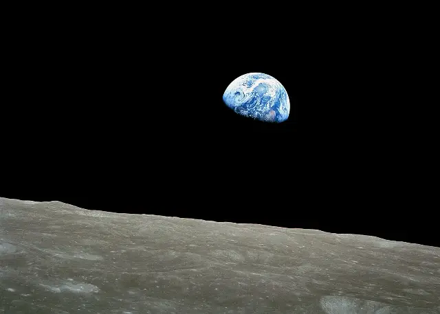 The Earth rising above the lunar horizon, photographed by Bill Anders from Apollo 8 on Christmas Eve 1968