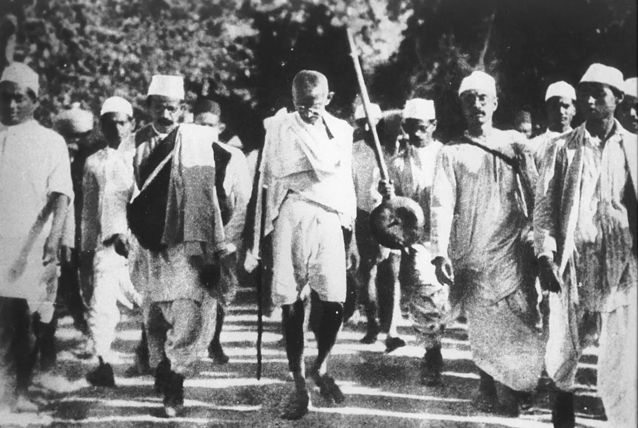 Gandhi, center with staff, marching with followers during the Salt March in March 1930.