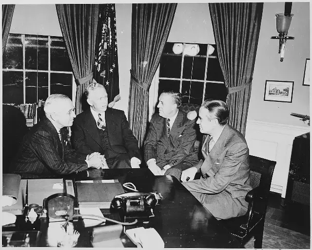 President Truman meets with George Marshall, Paul Hoffman, and Averell Harriman in the Oval Office in 1948; illustrative.