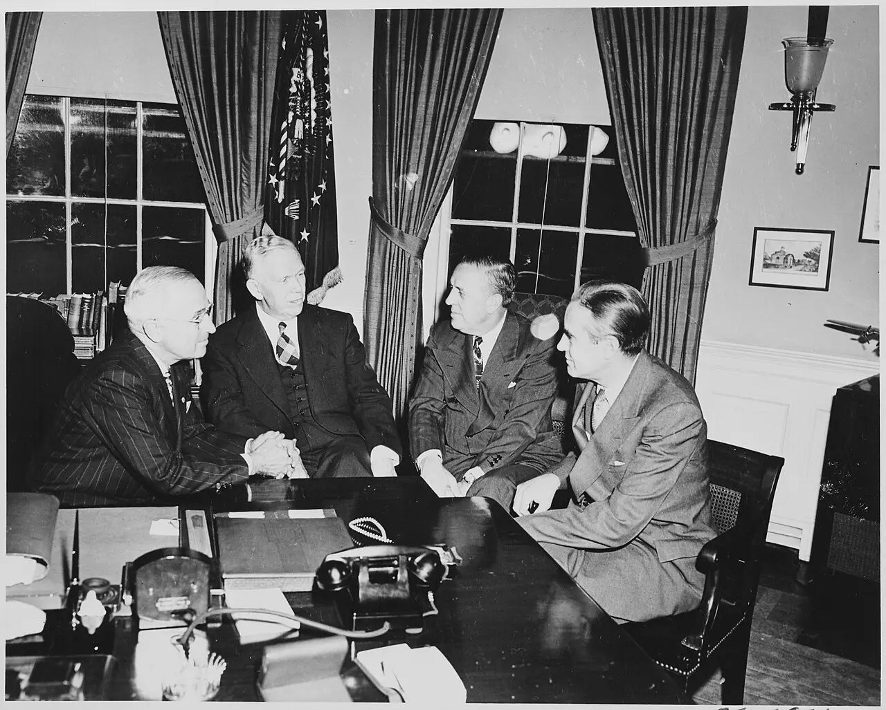 President Truman meets with George Marshall, Paul Hoffman, and Averell Harriman in the Oval Office in 1948; illustrative.