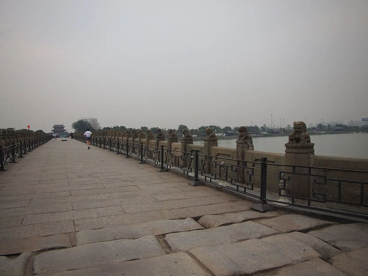 The Lugou Bridge (Marco Polo Bridge) near Beijing, its parapets lined with carved stone lion statues.