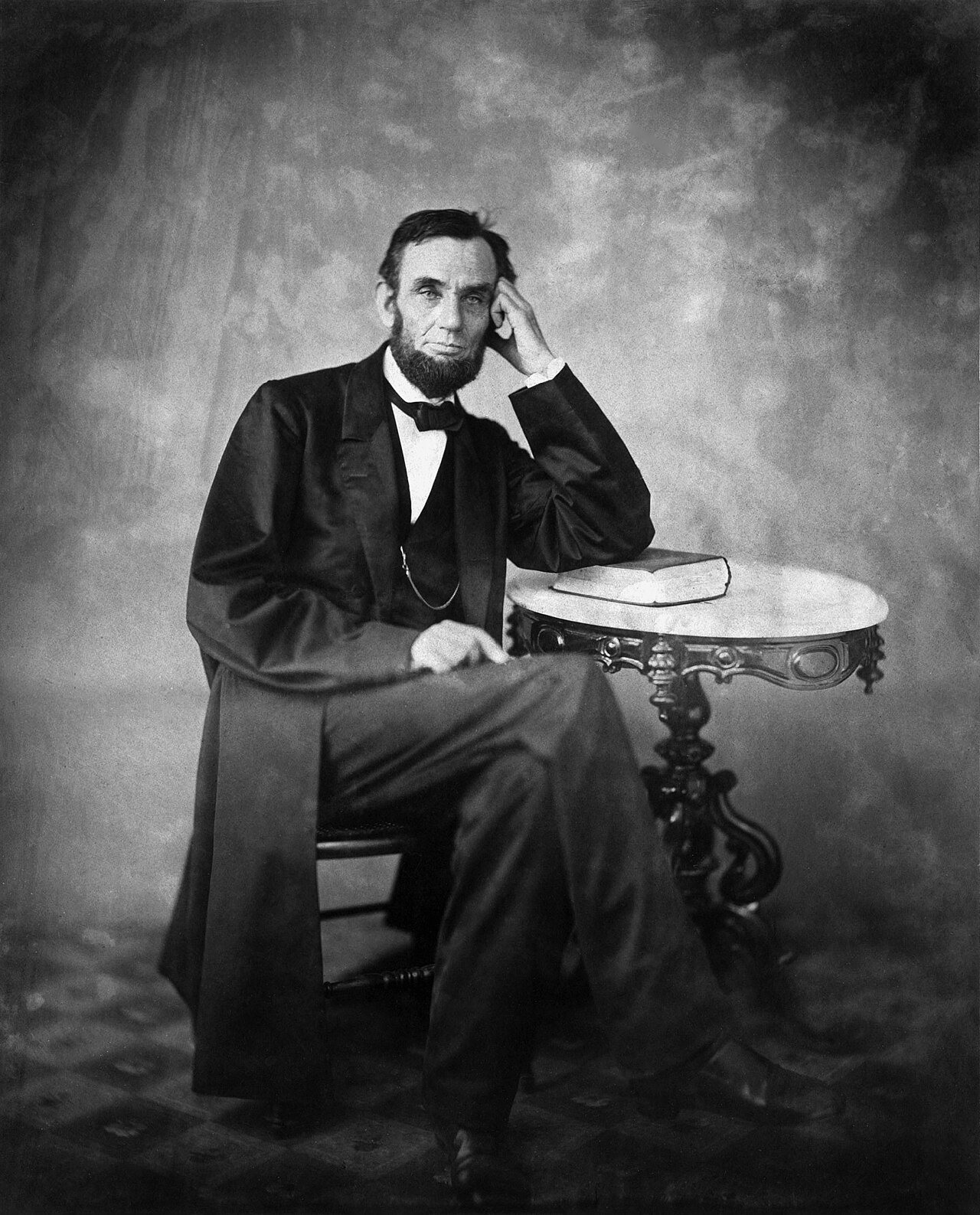 Seated photographic portrait of Abraham Lincoln by Alexander Gardner, taken in 1863 — an illustration, not an image of the 1865 assassination