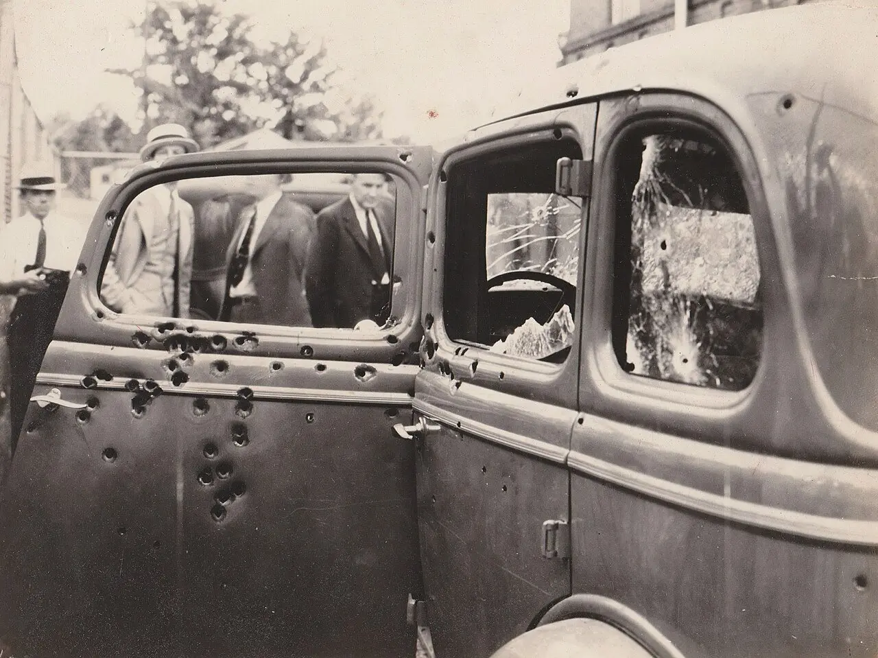 1934 photograph of Bonnie Parker and Clyde Barrow's bullet-riddled Ford V-8 after the Louisiana ambush.