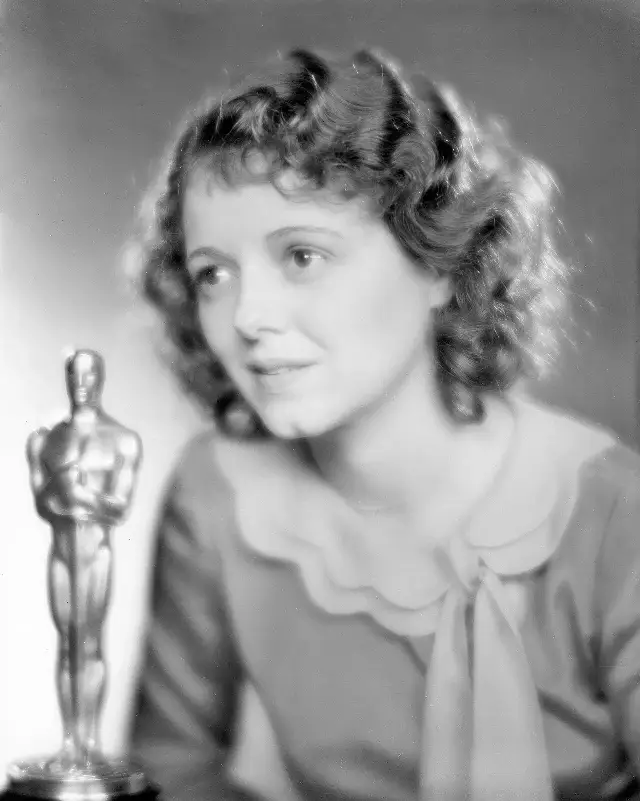 Janet Gaynor holding her Best Actress Oscar at the 1st Academy Awards ceremony on May 16, 1929 (Academy photograph).