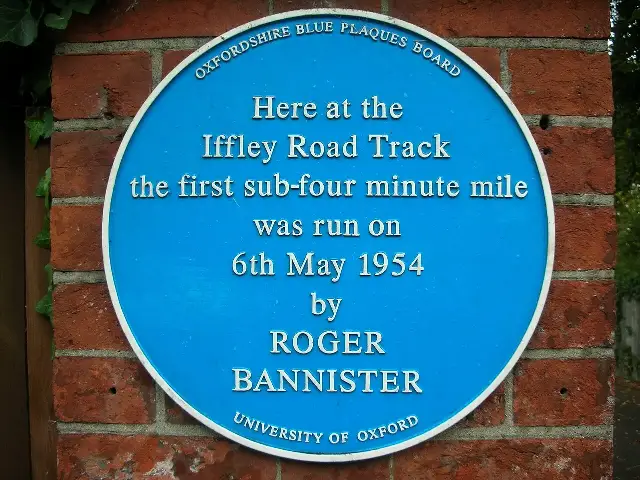 Blue plaque at Oxford's Iffley Road Track marking where Roger Bannister ran the first sub-four-minute mile on May 6, 1954