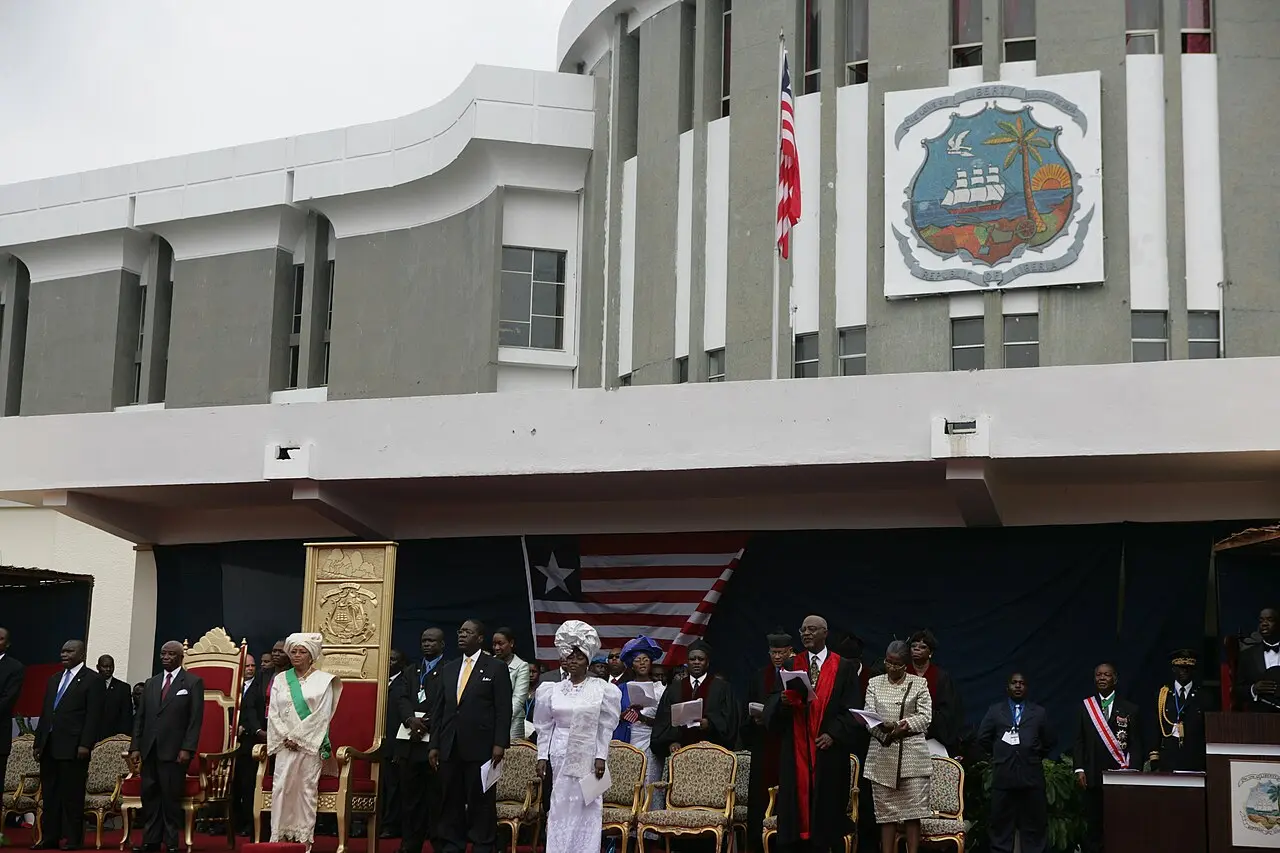 Ellen Johnson Sirleaf's inauguration ceremony in Monrovia, Liberia, on January 16, 2006, with the Liberian flag and presidential seal.