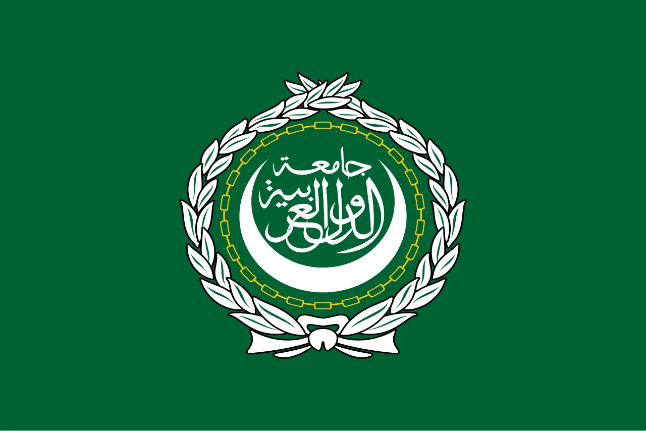 The green flag of the Arab League with its white emblem of a crescent and Arabic calligraphy inside a wreath.