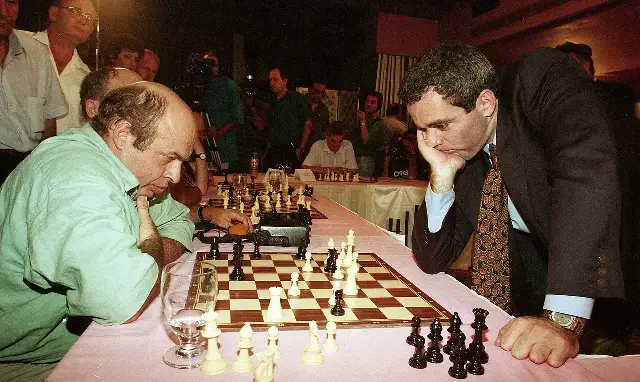 Garry Kasparov hunched over a chessboard during a simultaneous exhibition in Jerusalem