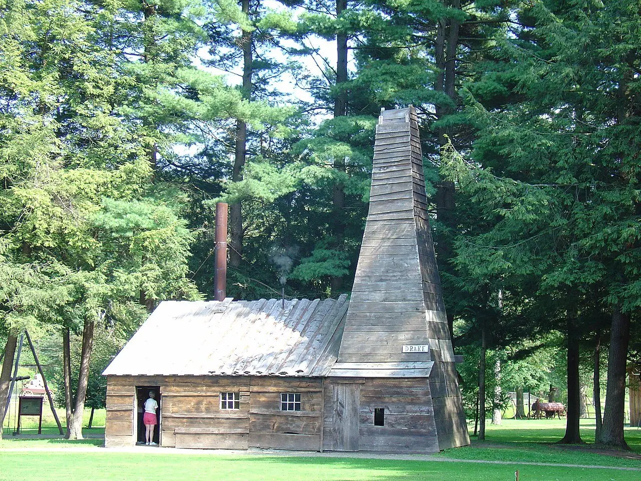 The reconstructed Drake Well derrick at the Drake Well Museum in Titusville, Pennsylvania — a replica of the 1859 well where Edwin Drake first struck oil.